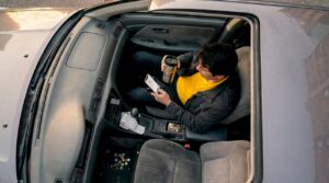 Gig driver checks rideshare app before shift