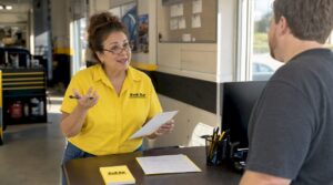 Auto shop manager reviewing customer feedback