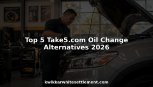 Mechanic changing oil in SUV at auto repair shop