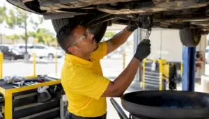 Technician performing express quick-lube oil change