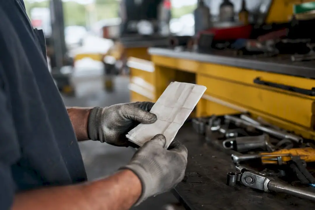 Hands showing technician certification on tablet