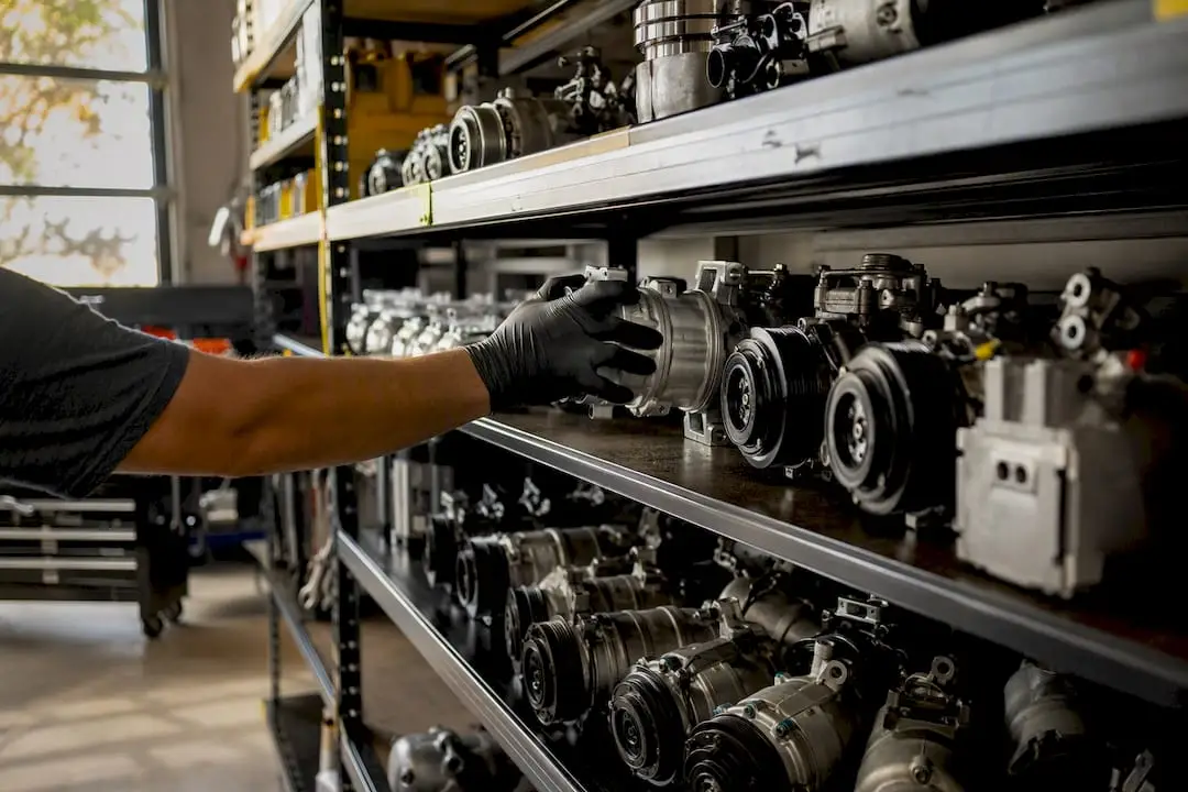 Remanufactured AC compressor on parts shelf