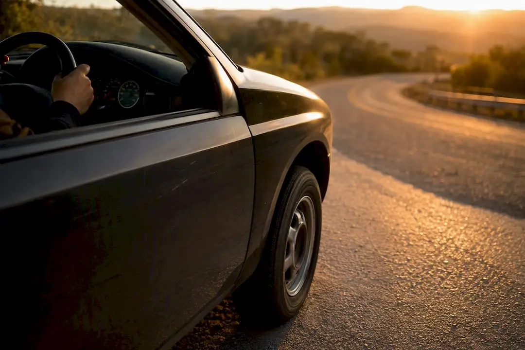 Hands steering car gently for bearing noise test