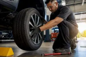 Technician performing a tire rotation