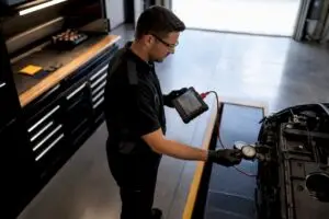 Technician performing a second vehicle diagnostic