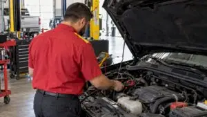 Technician testing vehicle starter circuit