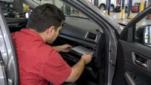 Technician removing a cabin air filter