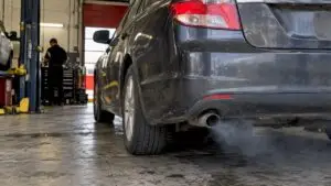 Thin exhaust plume emerging from an idling car